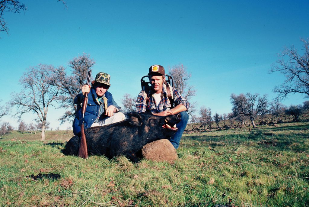 Browning 92: Payton Miller and Mike Ballew with a big California boar, taken in about 1980 with one of Browning’s first Model 1892s in .44 Magnum. The 240-grain soft-point penetrated both shoulders and kept on going!