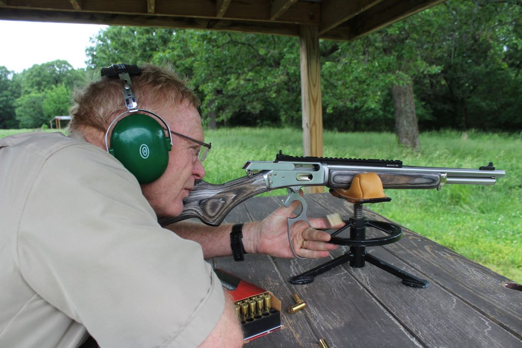 IMG_1317: On the bench with a new Marlin 1894 in .44 Magnum. This is one of smoothest and slickest lever-actions Boddington has used. The rail mount has integral aperture sight, but offers full range of mounting with optics.