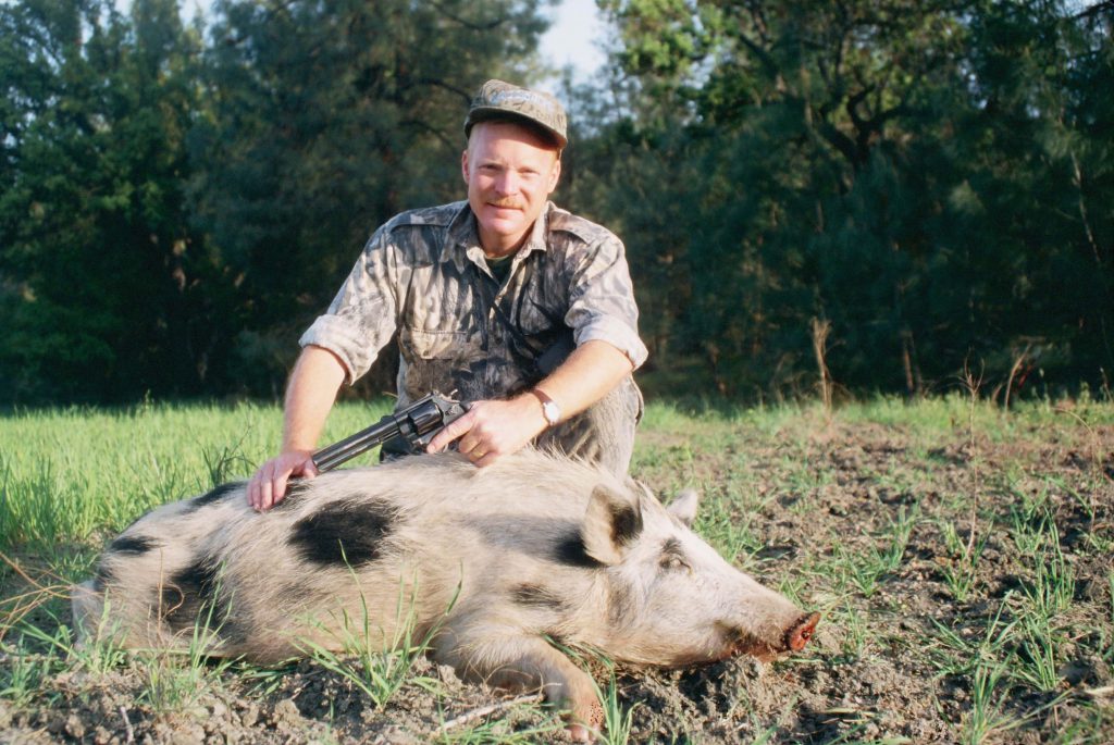 Feral hog 44: This S&W Classic Hunter with 6.5-inch barrel has long been one of Boddington’s favorite hunting handguns, accurate and manageable. This is an extremely ugly California boar, taken with Garrett’s 310-grain super-hard-cast load.