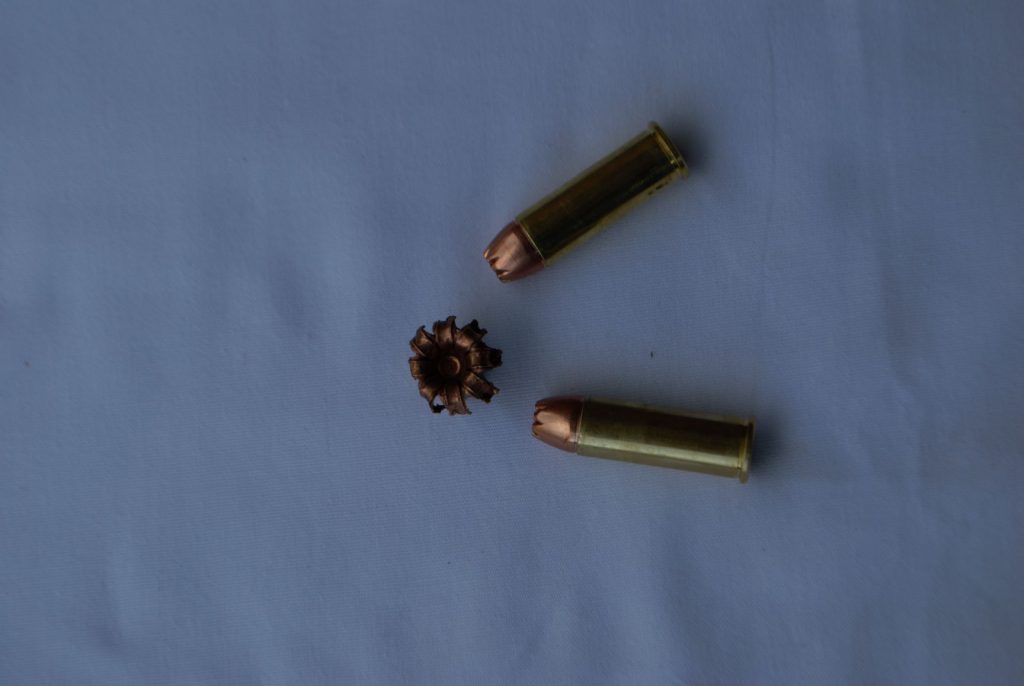 All copper-alloy expanding bullets have a hollow nose cavity and skived tip, with various numbers of serrations or splits, causing petals to peel back. This is a 200-grain Hornady MonoFlex .44 Magnum bullet, recovered from a whitetail buck.
