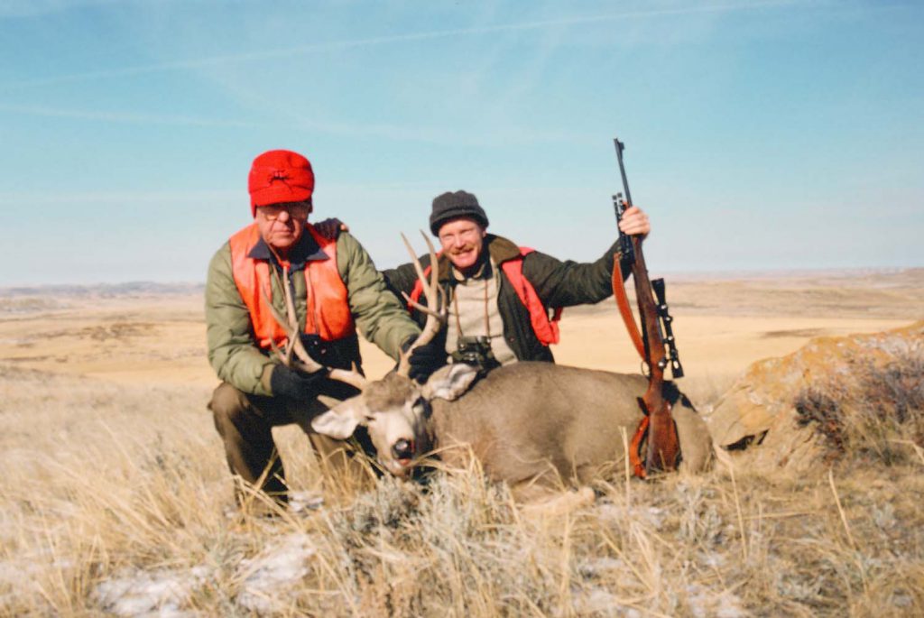 My Dad and I with his Montana mule deer, taken with his M70 Featherweight that he used for almost his hunting. This rifle, with an impossible stock for a lefty, is the only Model 70 I have. This one is not for sale!
