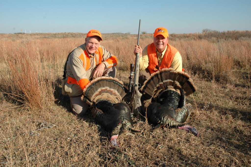 Boddington and friend Joey Meiberger with two gorgeous Oklahoma fall gobblers, taken with a Ruger in .17 HMR. Legal in just a few states, hunting turkeys with a rifle may not be the purist’s approach, but it’s fun, and the little .17 HMR ruins very little meat.
