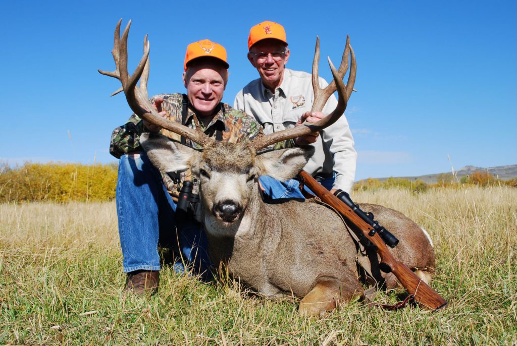 Wyoming mule deer: Boddington and Tom Arthur with a fine Wyoming mule deer, shot at dusk the previous evening by shooting off a pack at about 270 yards. Fairly typical of much Western hunting, this was not a “gimme” shot—but certainly not especially difficult.