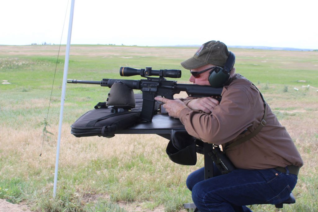 IMG_6820: On a portable bench in a Wyoming prairie dog town with a Rock River AR in .223/5.56mm. Newer .22 centerfires deliver more velocity and energy, but the .223 remains accurate, effective, and versatile.