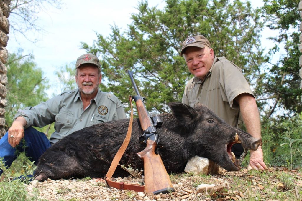 Byron Sadler and Boddington with a big-tusked Texas boar