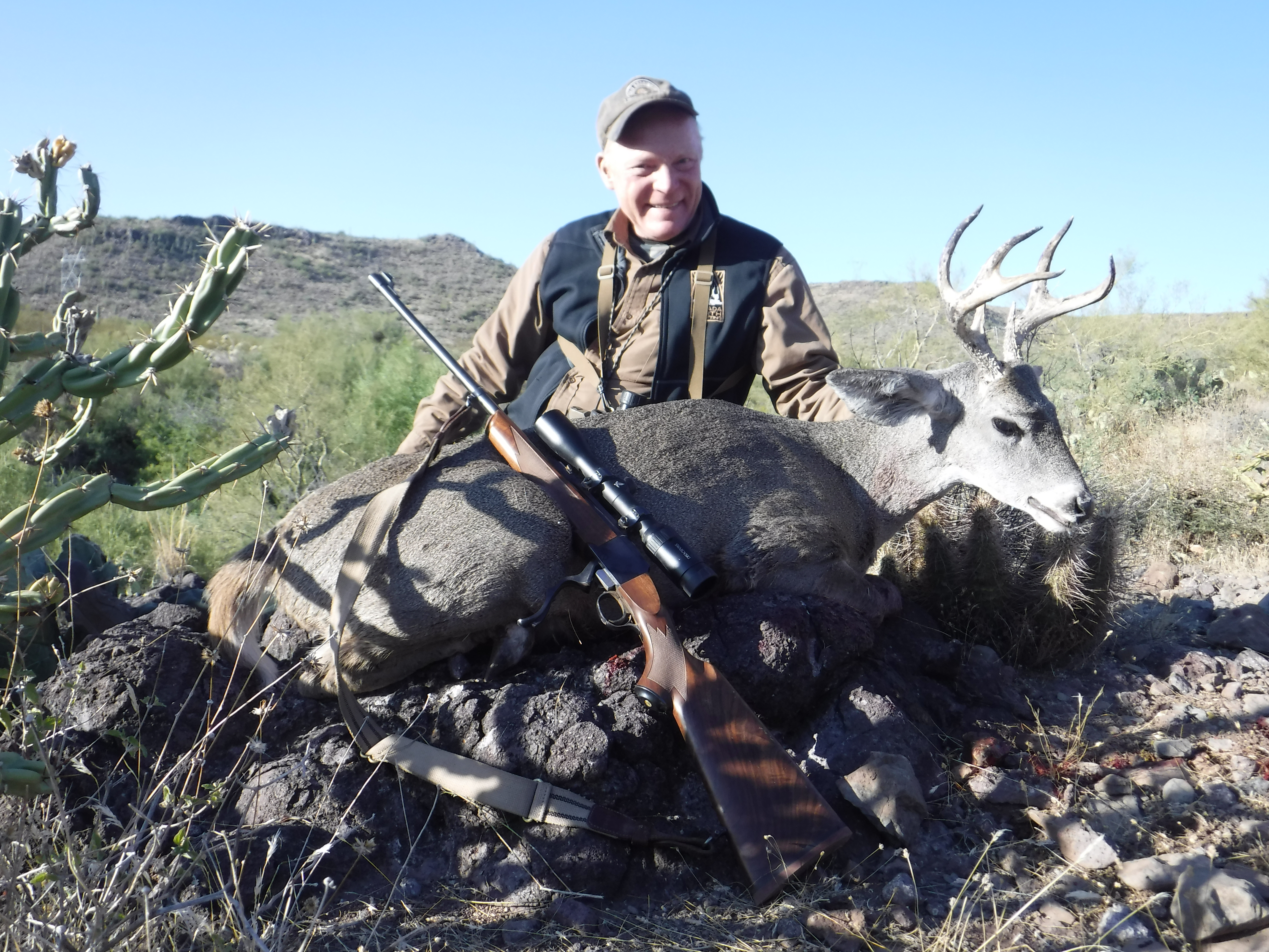 Boddington used his Ruger No. 1 in .280 AI to take this Coues whitetail in Arizona, range about 350 yards. The first shot went over, not the cartridge’s fault. Luckily the buck stood and dropped to the second attempt.